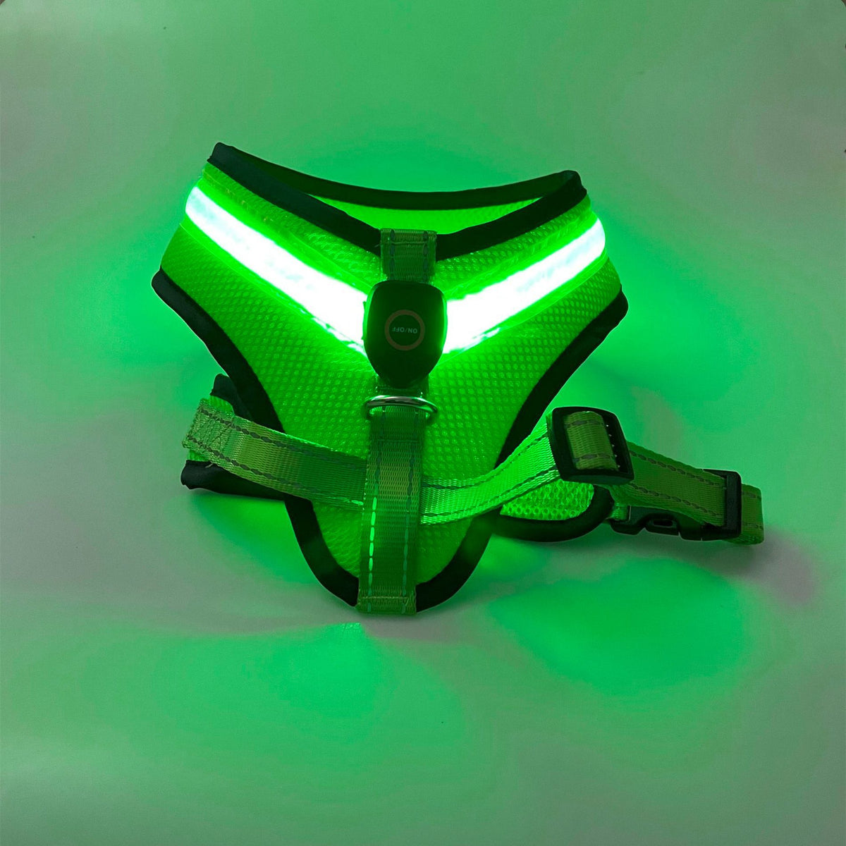 Light-up harness glowing green in the dark