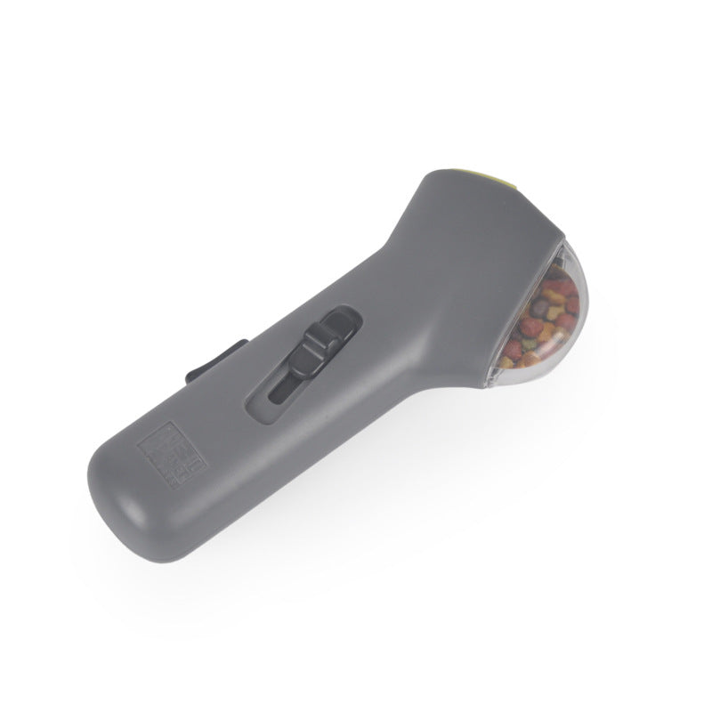 Grey handheld dog treat launcher