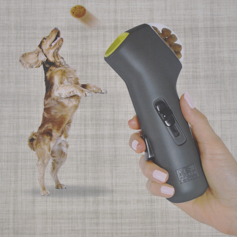 Dog leaping for a treat fired from the handheld dog treat launcher