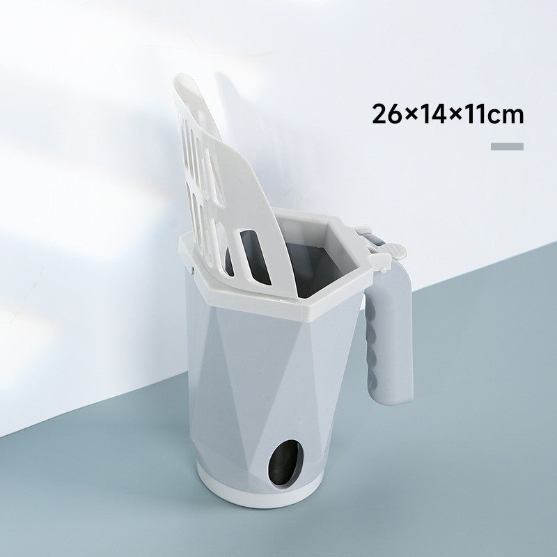 Grey cat litter scoop in its holder