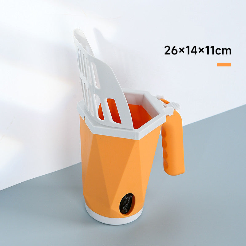 Orange cat litter scoop standing in its holder, 26 x 14 x 11 cm