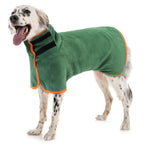 Spotted dog drying off in the green drying coat